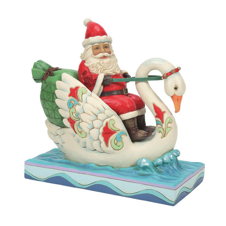heartwood creek santa riding swan figurine