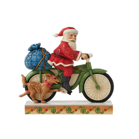 heartwood creek santa riding bike figurine