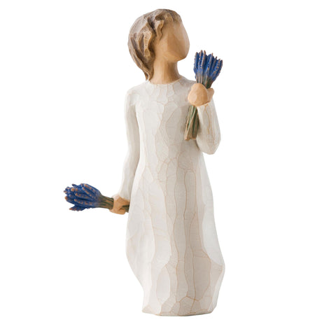 Young lady girl  figurine holding lavender