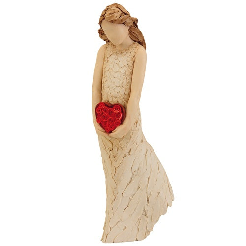 Sculptured girl figurine holding a heart of roses