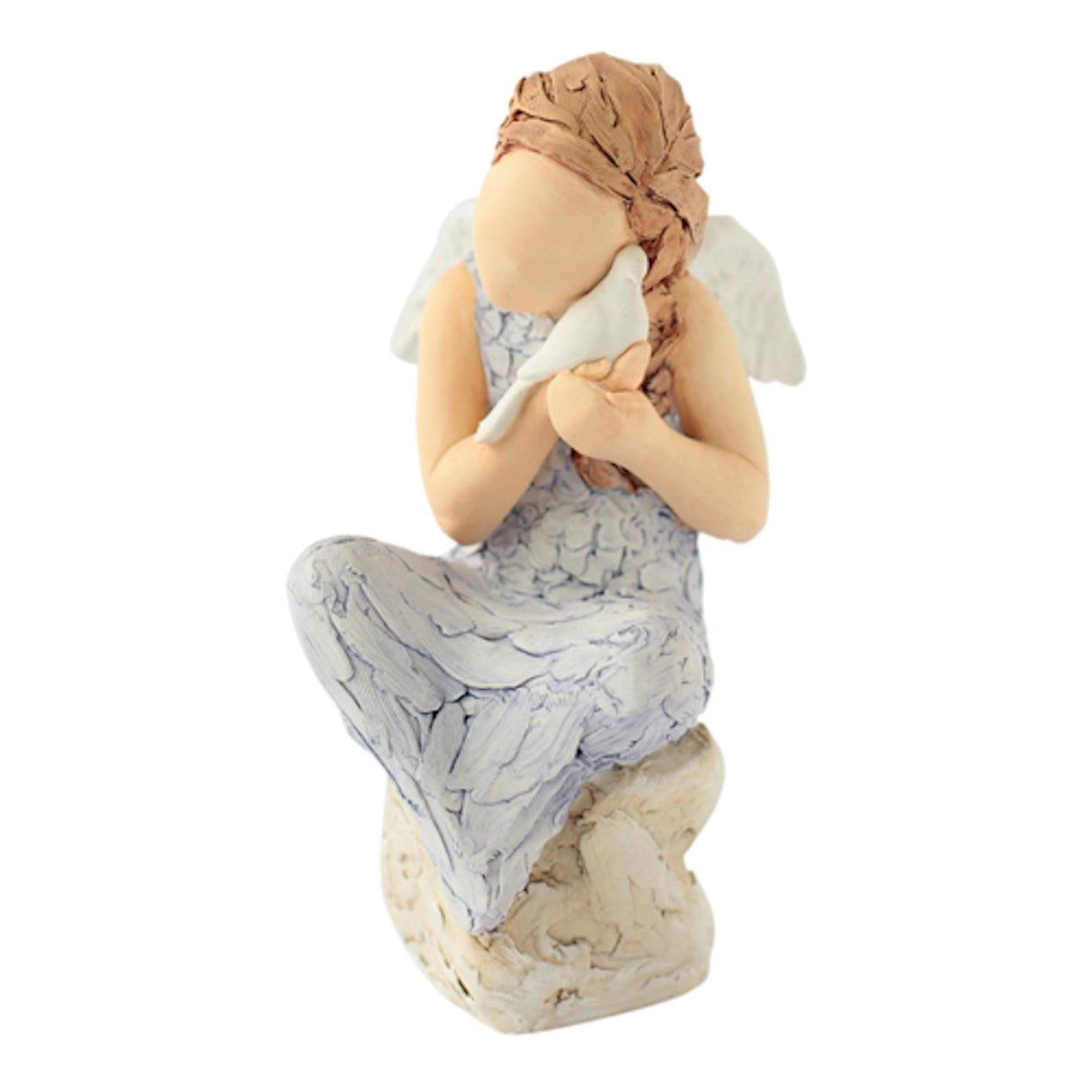 Angel sitting on a rock cradling a dove