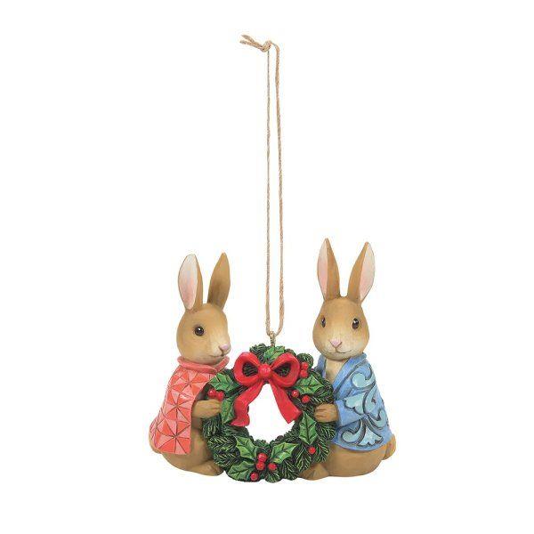 The holidays are about spending time with those we love most. This sweet ornament by Jim Shore features cherished Beatrix Potter characters, Peter Rabbit and Flopsy, holding a festive wreath. In their classic garb, the pair celebrate togetherness. Height: 8.0cm