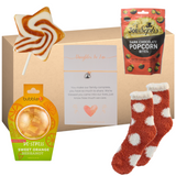 daughter in law pamper gift box with bath bomb socks bracelet and popcorn