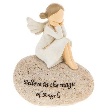 Angel sat on stone with head in hands,  wording on stone "Believe in the magic of Angels"