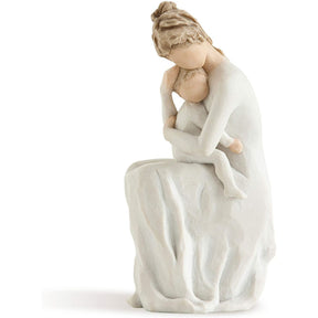 Mum holding baby figurine
